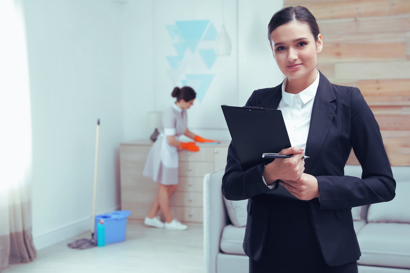 Housekeeping Manager Checking Maid Work in Hotel Room